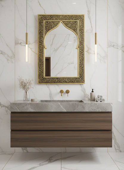 Engraved brass arch mirror above bathroom vanity