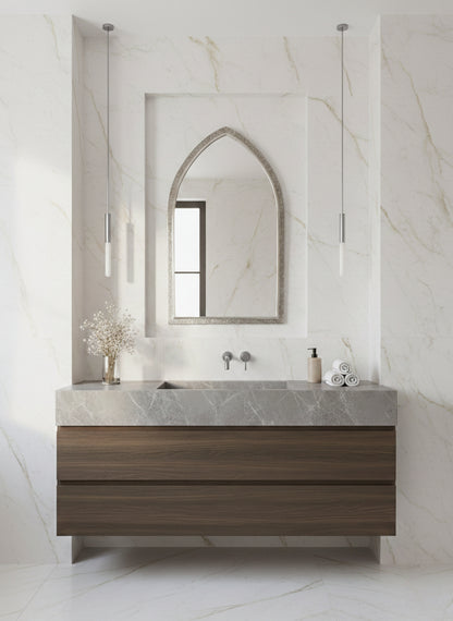 Arch brass mirror in marble bathroom