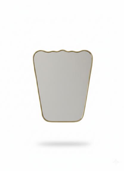 Scalloped brass wall mirror on white background