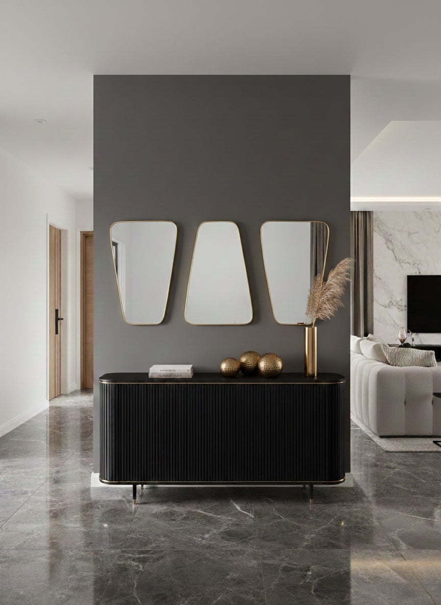 Brass mirrors above black console