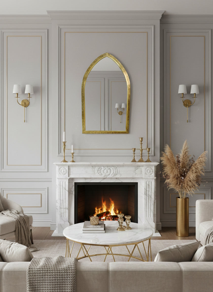 Arch brass mirror above marble fireplace