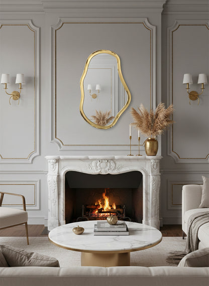 Irregular gold brass mirror above classic fireplace