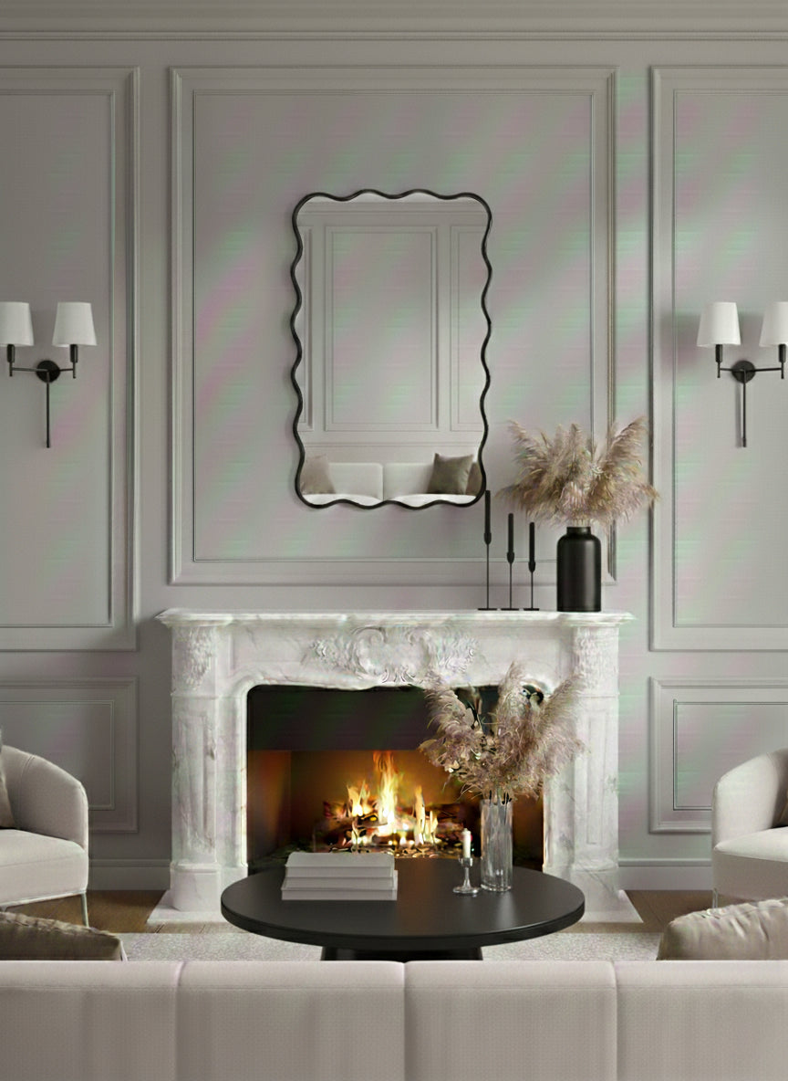 Scalloped black brass mirror above classic fireplace mantel.