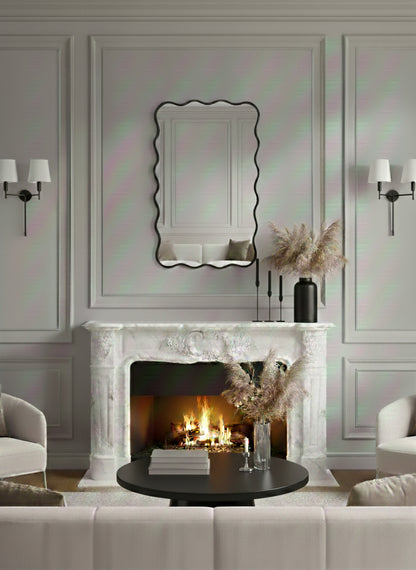 Scalloped black brass mirror above classic fireplace mantel.