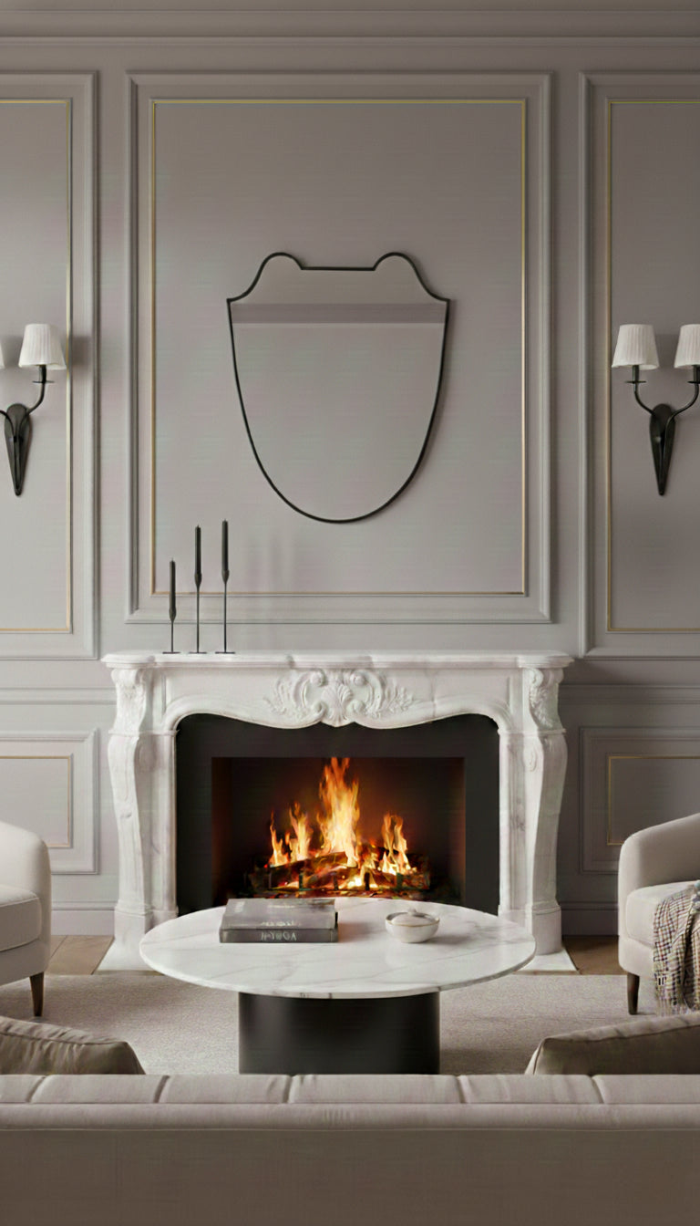 Black brass Italian shield mirror styled over a classic fireplace