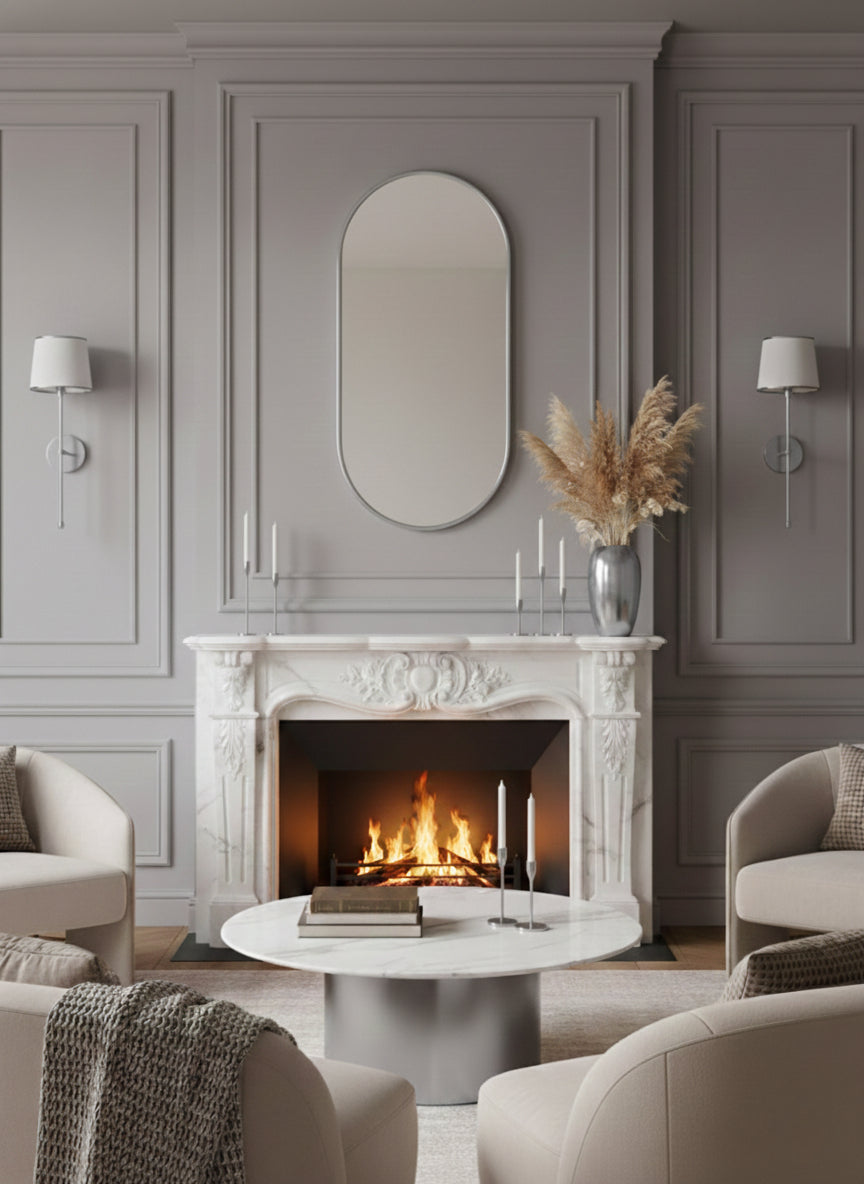 Silver capsule mirror above fireplace mantel in elegant living room.
