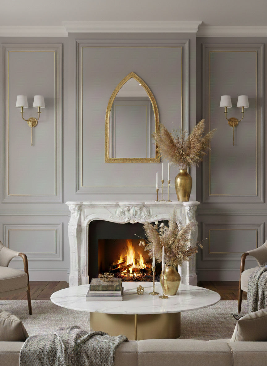 Gold brass arch mirror above fireplace in classic living room