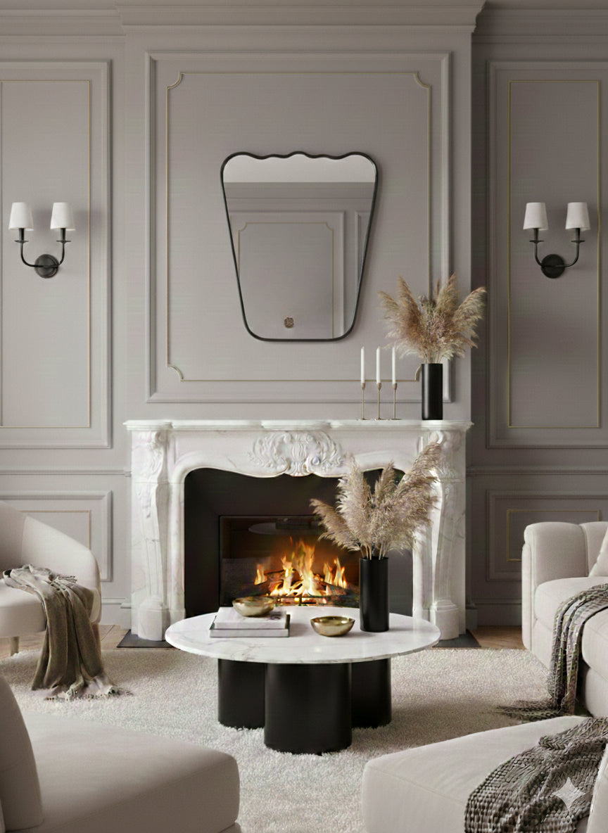 Wavy brass mirror above fireplace