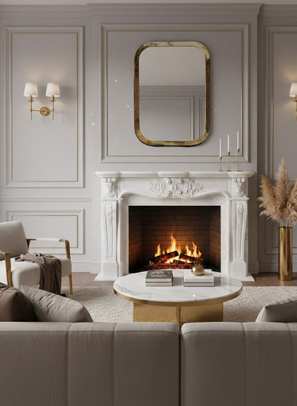 Rounded rectangular brass mirror above marble fireplace mantel