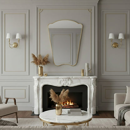 Italian style irregular mirror above marble fireplace in elegant living room
