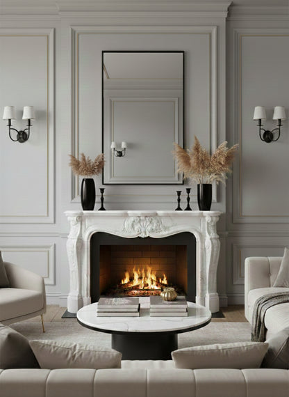 Black framed rectangular mirror above classic white fireplace mantel.