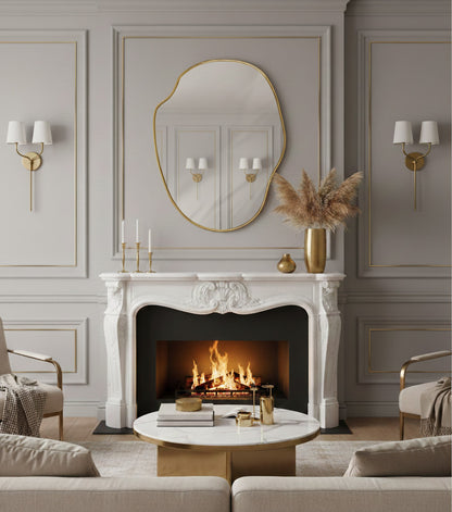 River stone brass mirror above classic white fireplace mantel.