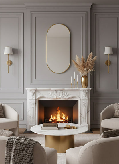 Oval brass wall mirror above classic marble fireplace in elegant living room