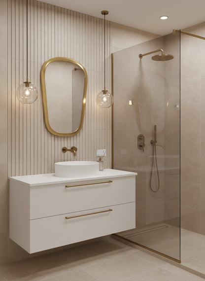 Brass mirror in modern bathroom with glass shower