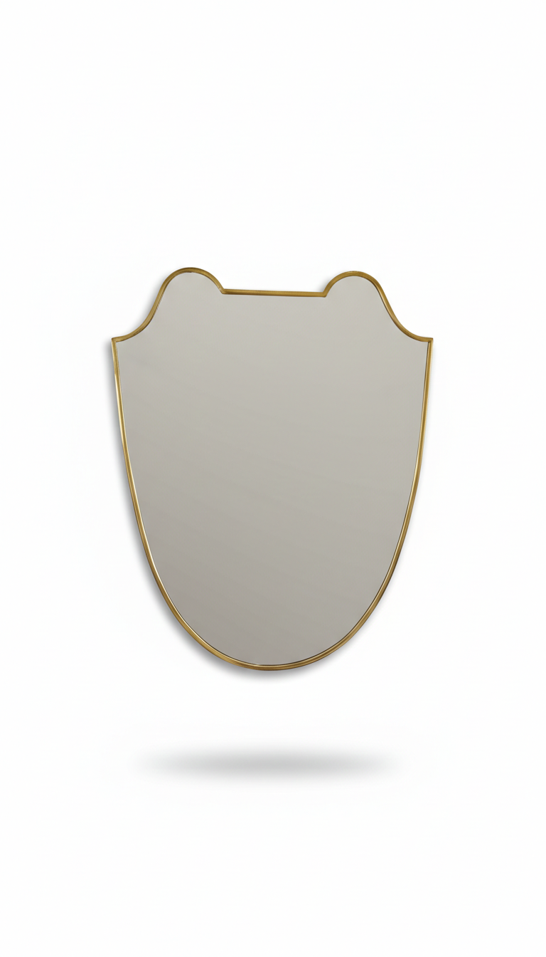 Curved brass mirror on white background