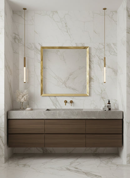 Gold square brass mirror in marble bathroom interior