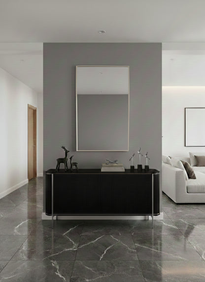 Modern rectangular mirror above black console table.
