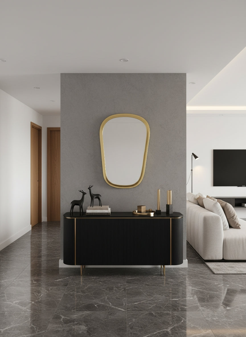 Brass mirror above black console table