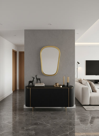 Brass mirror above black console table