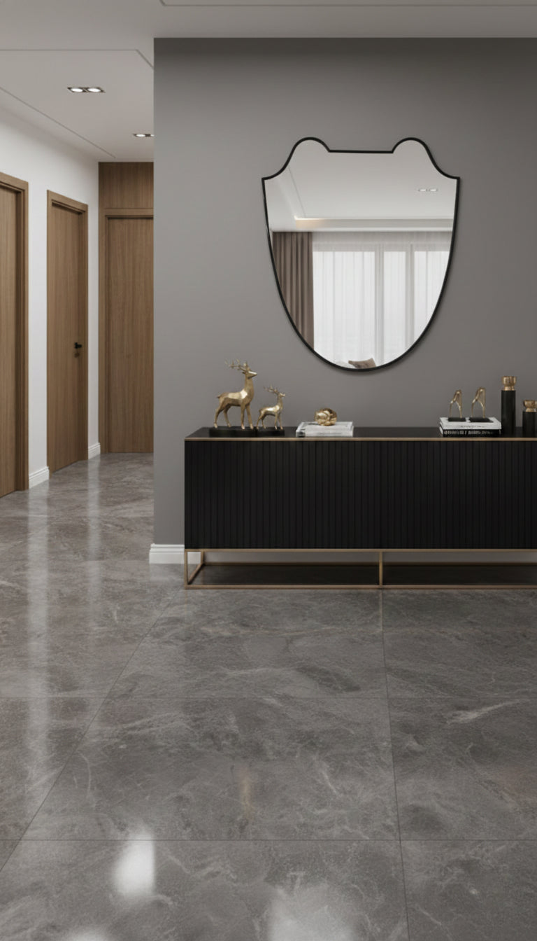 Black brass Italian shield mirror above a modern console table