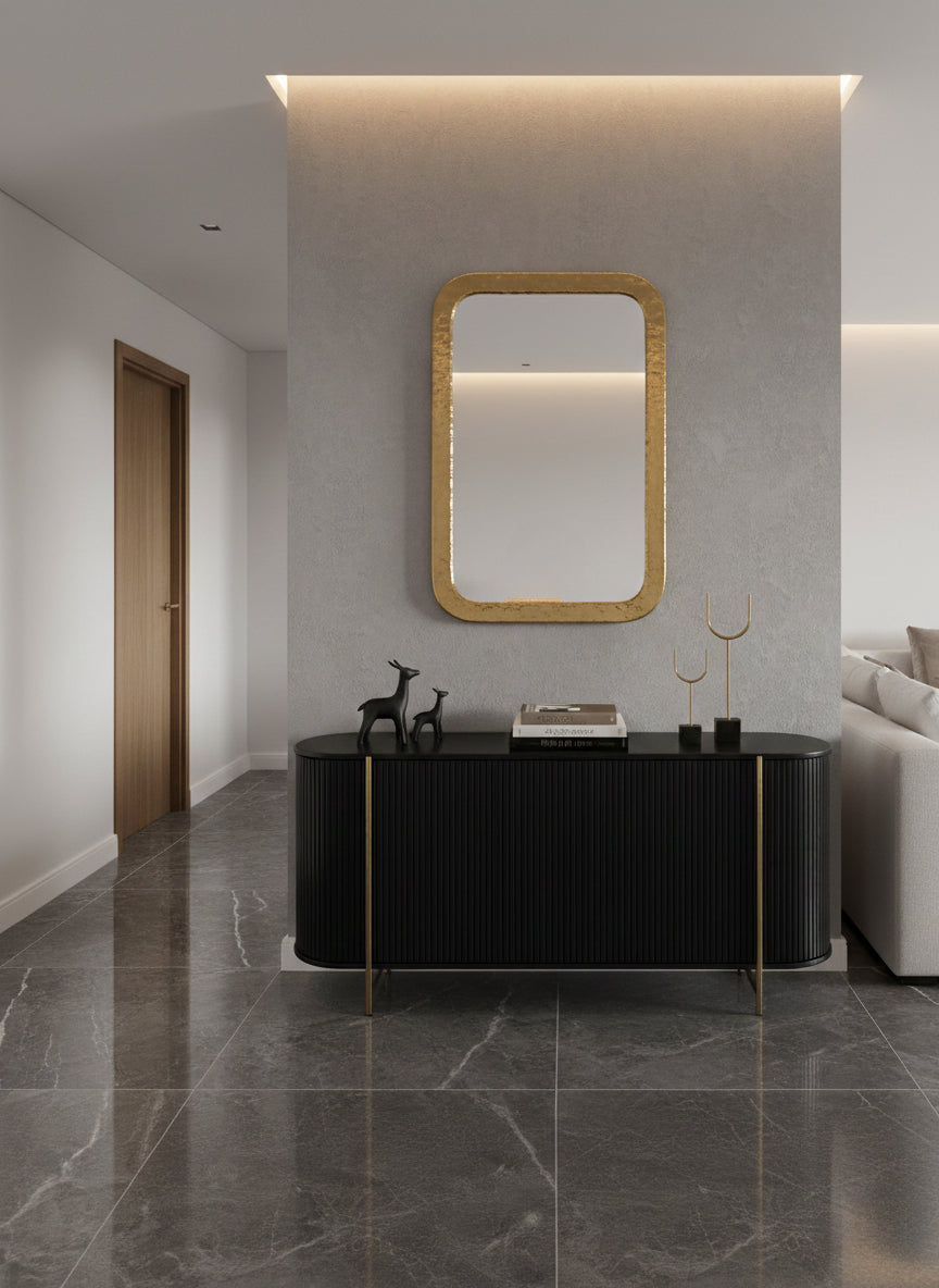 Rectangular brass mirror above black console