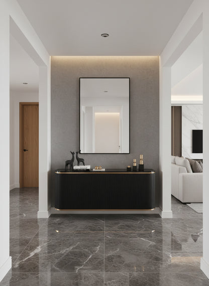 Minimal black rectangular mirror above modern console in hallway.