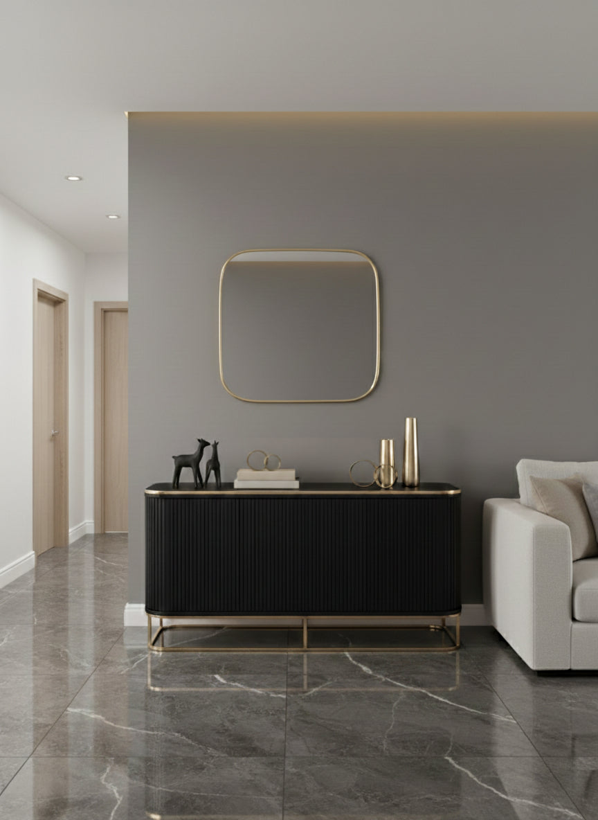 Square brass mirror above hallway console