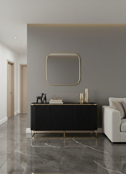 Square brass mirror above hallway console