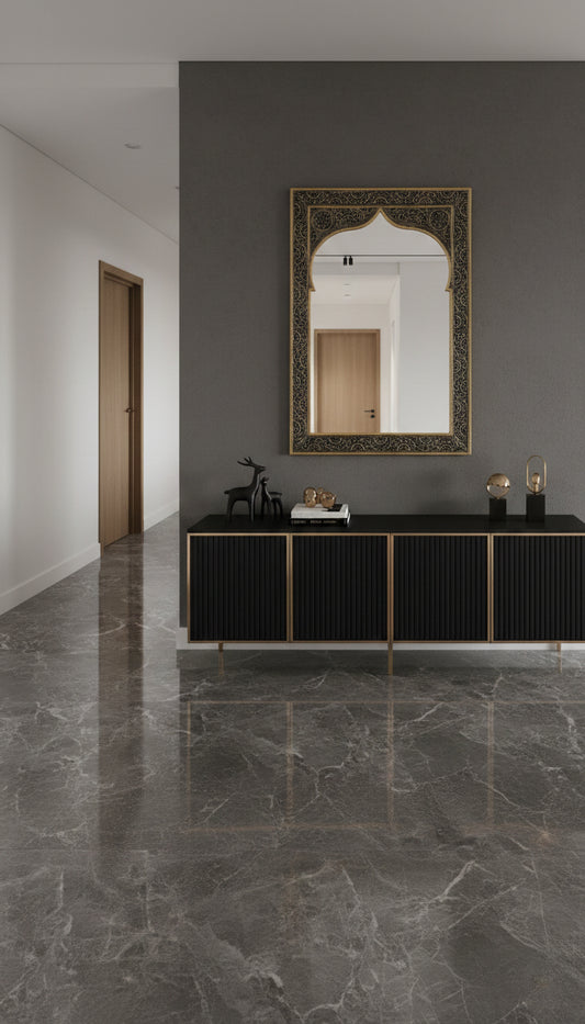 Engraved brass arch mirror above black console