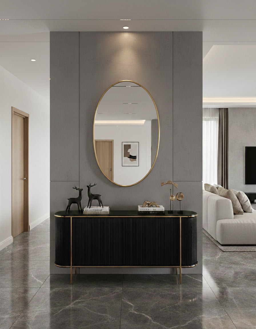 Oval brass mirror in modern hallway