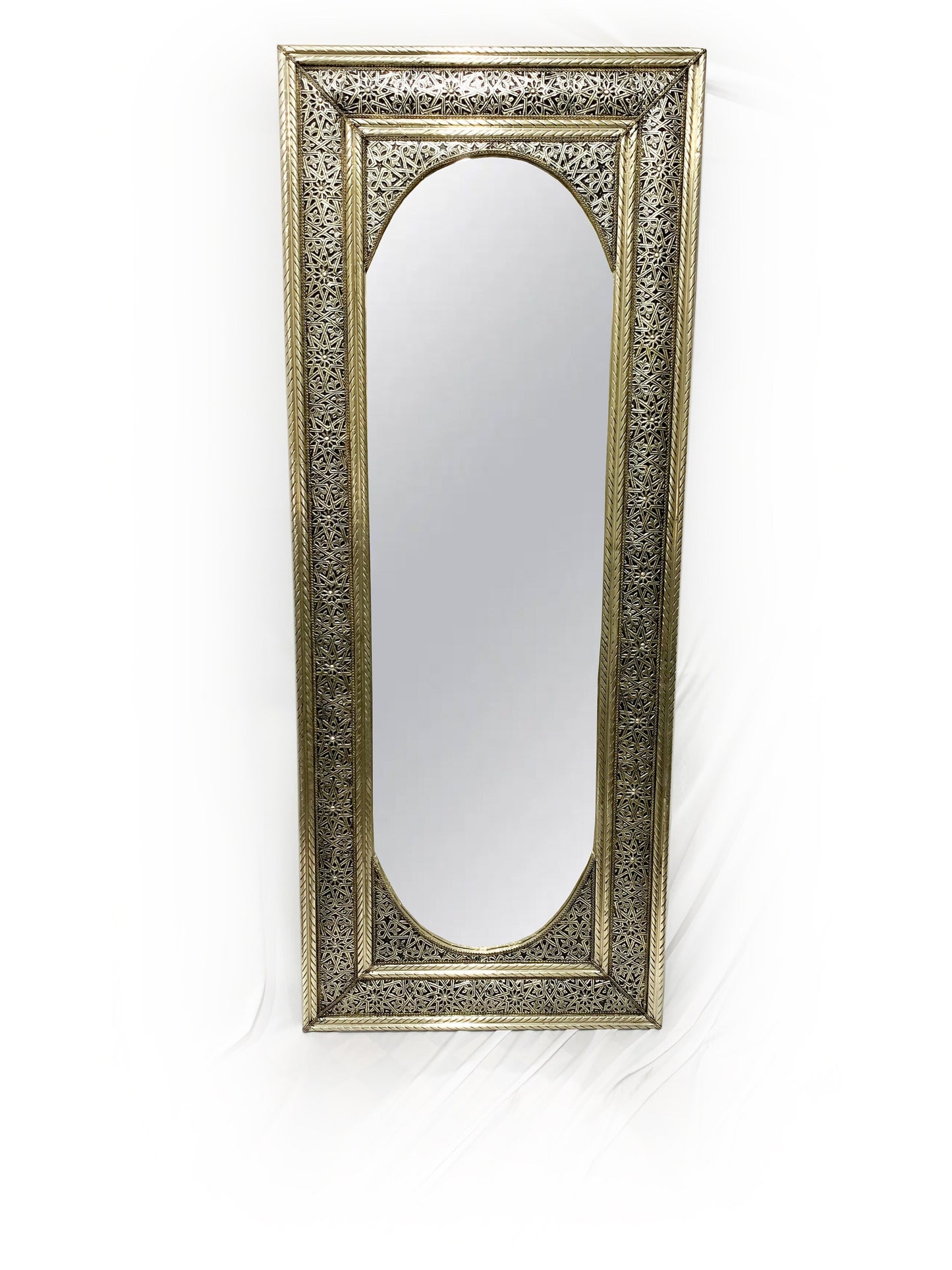 a mirror that is sitting on a wall