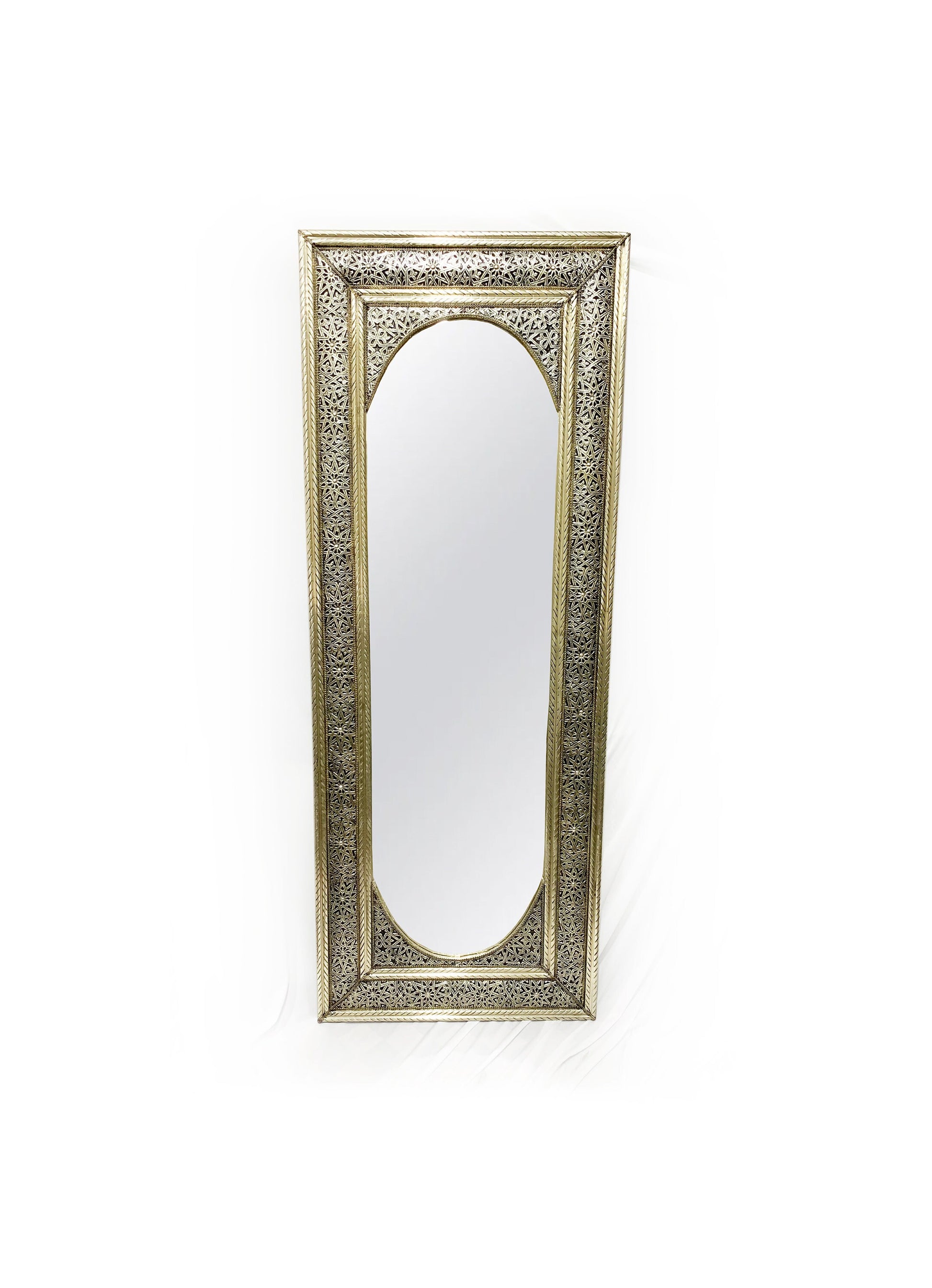 a full length mirror that is sitting on a wall