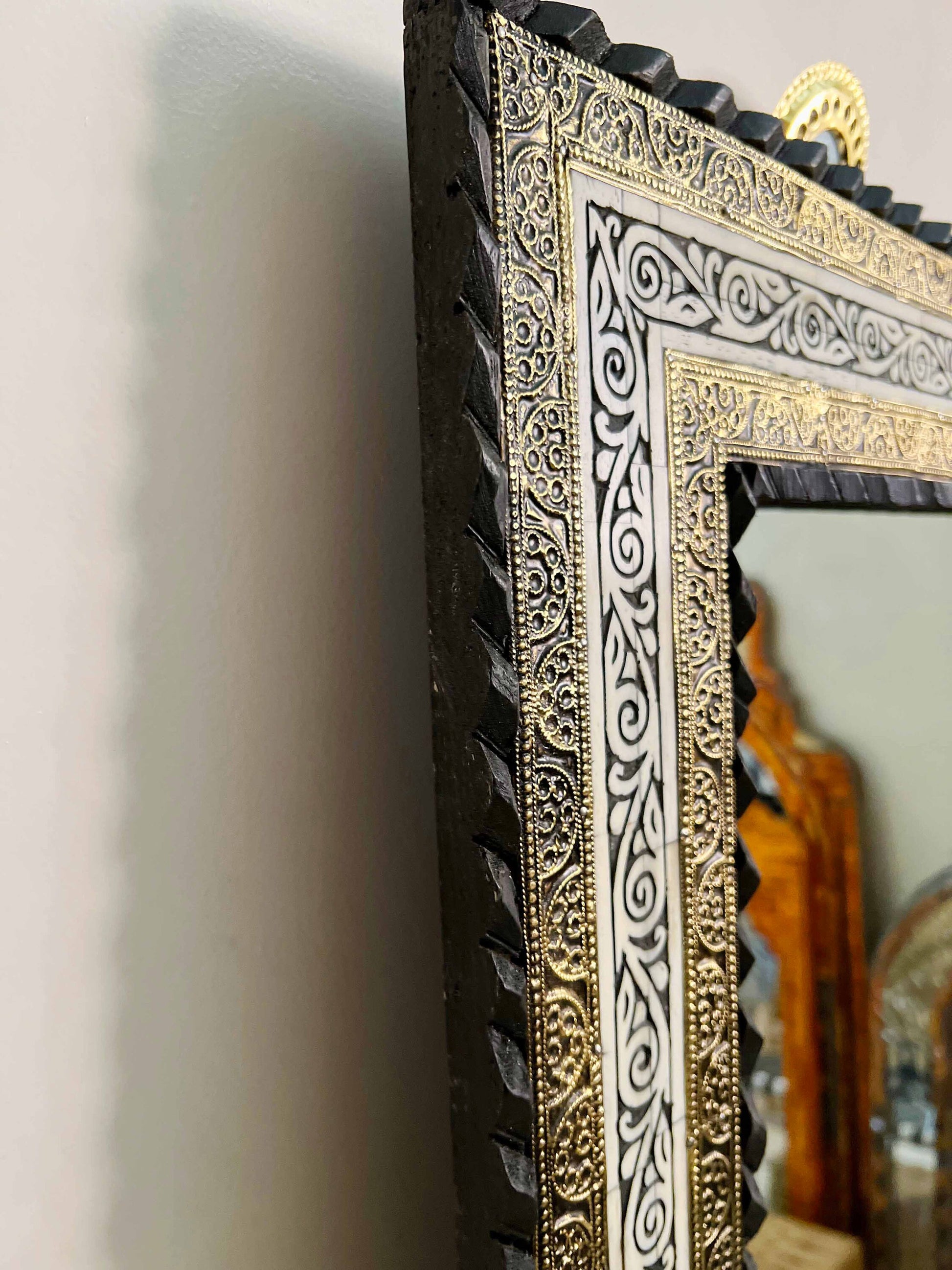 a picture frame with a decorative design on it