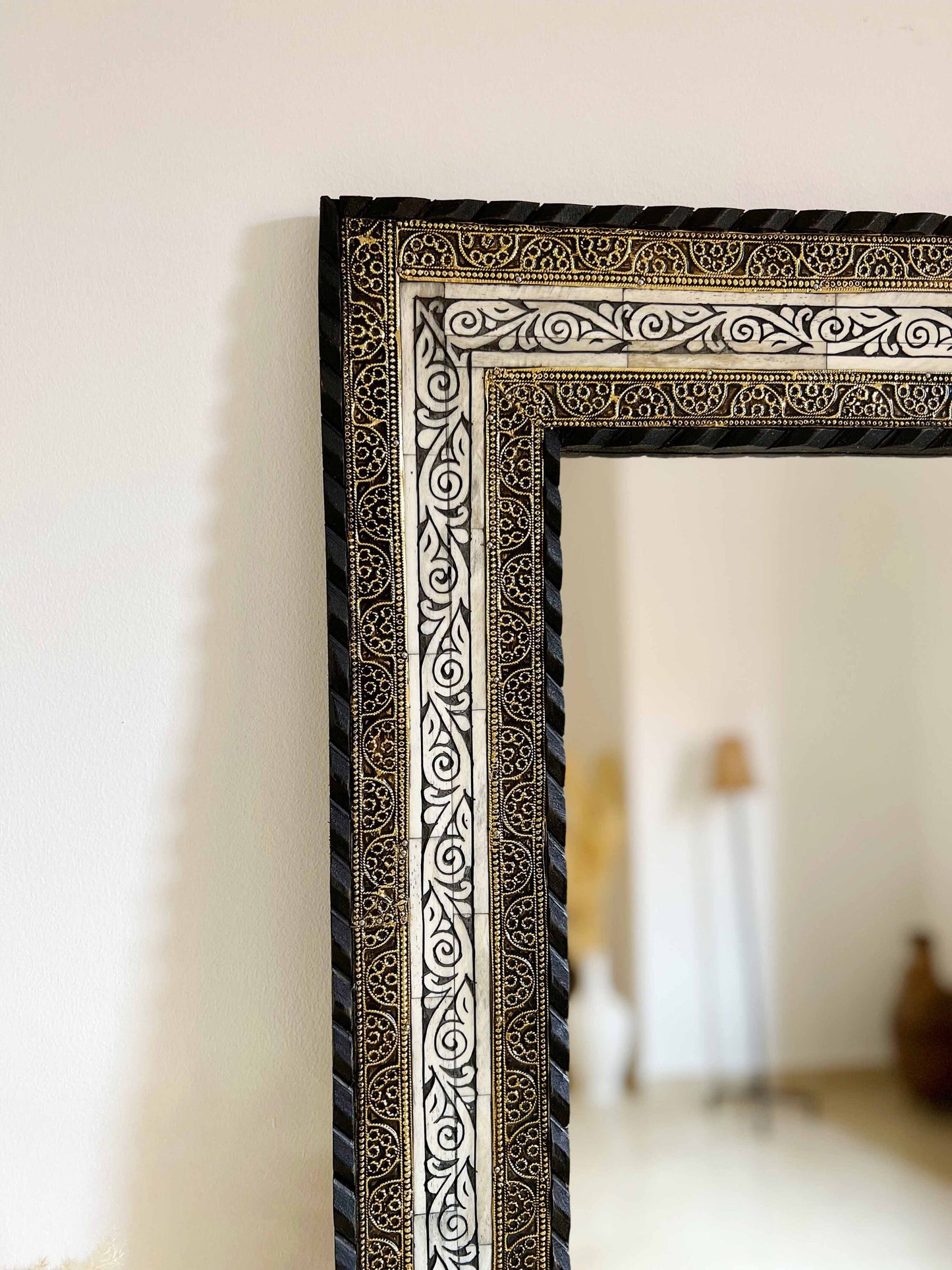 a black and white picture frame sitting on top of a table