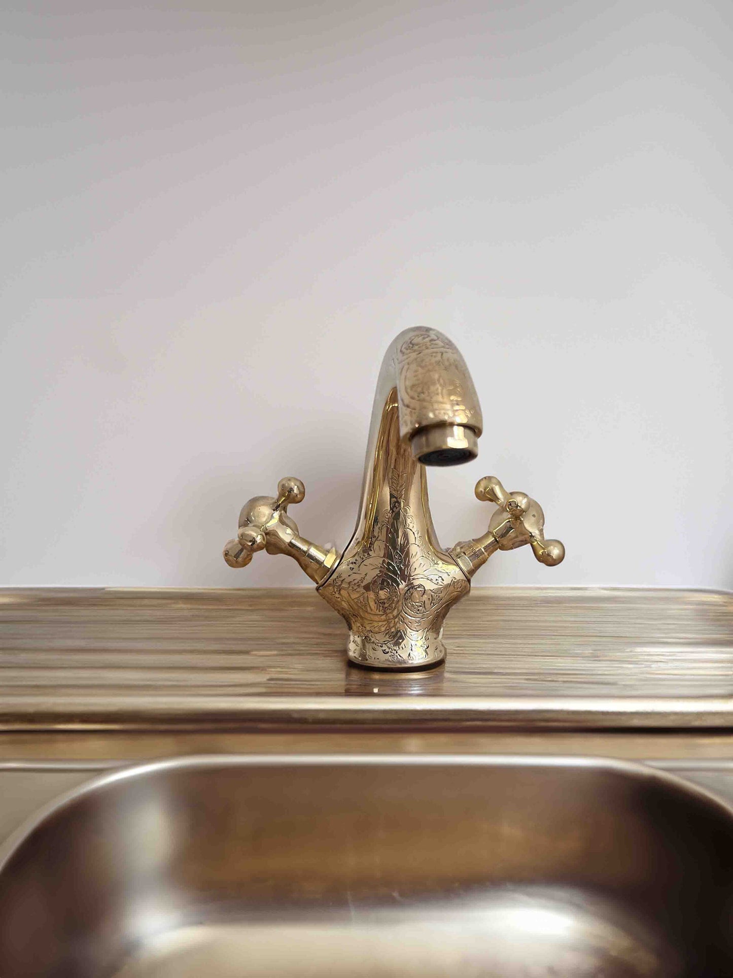 a sink with a faucet on top of it