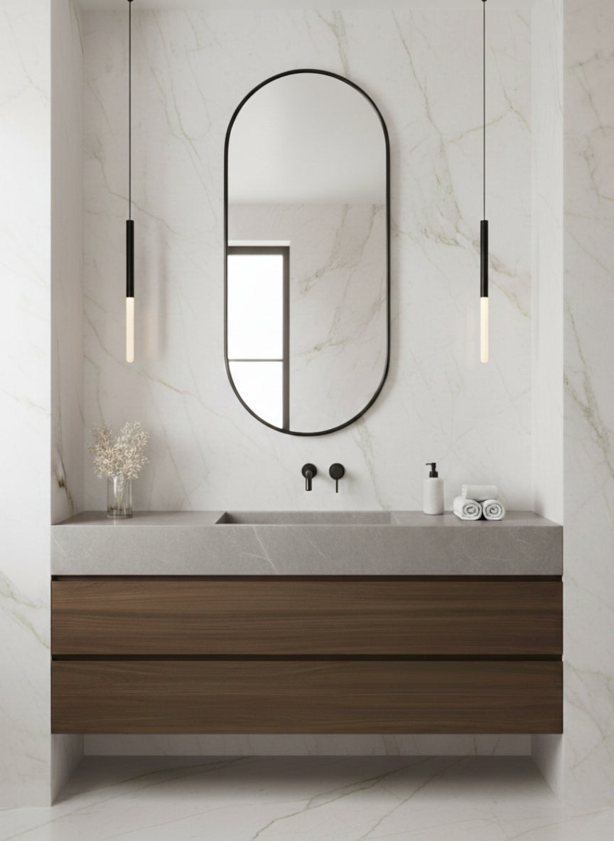 Black arched mirror above floating wood vanity.