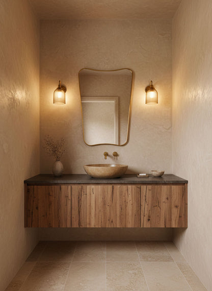 Butterfly brass mirror in warm minimalist bathroom