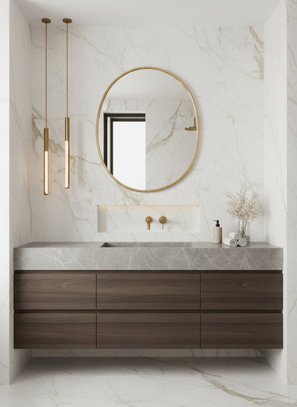 Oval brass bathroom mirror with a minimalist floating vanity