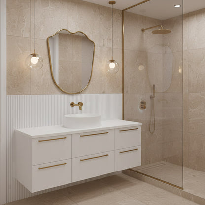 Wavy brass mirror in modern beige bathroom vanity