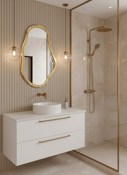 Irregular gold mirror in contemporary bathroom with shower