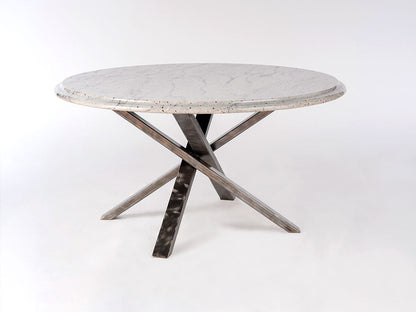 Round concrete table with metal legs on a white background