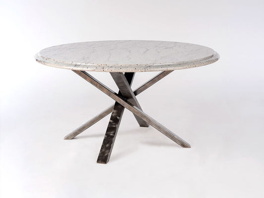 Round concrete table with metal legs on a white background