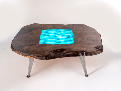 Wooden coffee table with a glowing blue center on a white background
