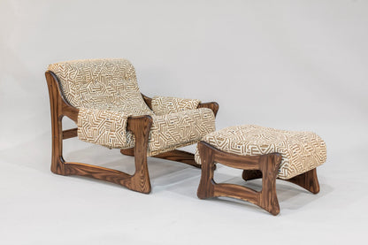 Wooden armchair and ottoman with patterned cushions on a white background