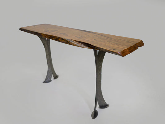 Wooden table with metal legs on a gray background