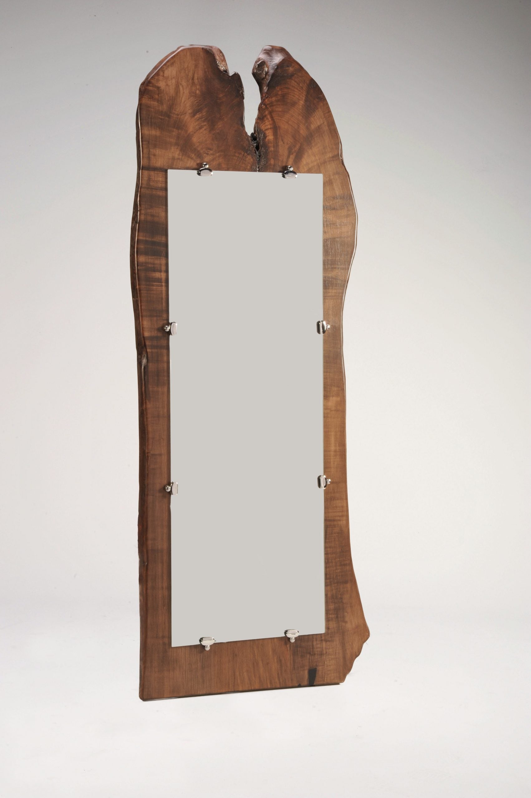 Wooden mirror with a natural finish on a white background