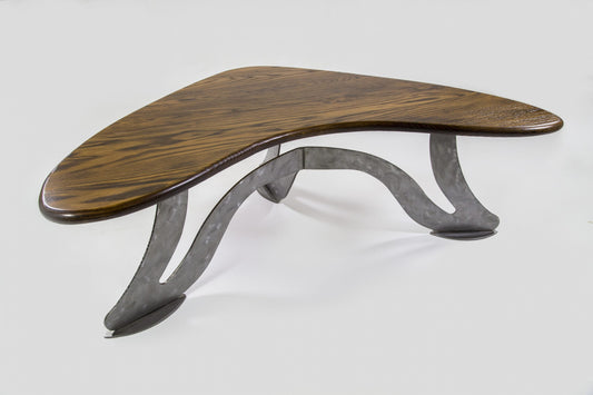 Wooden coffee table with a curved design on a white background