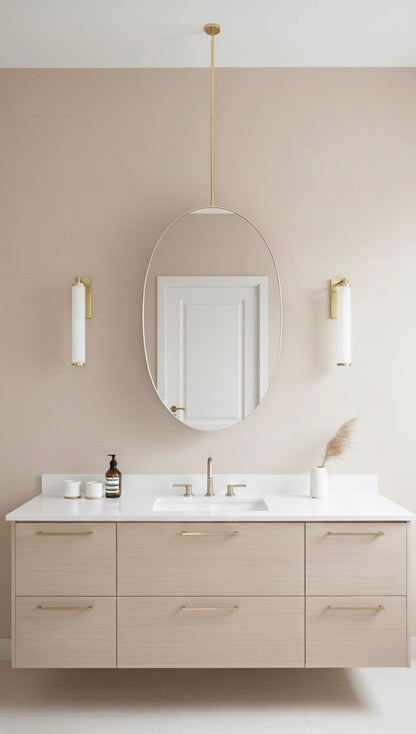 Oval brass ceiling mirror in modern neutral bathroom