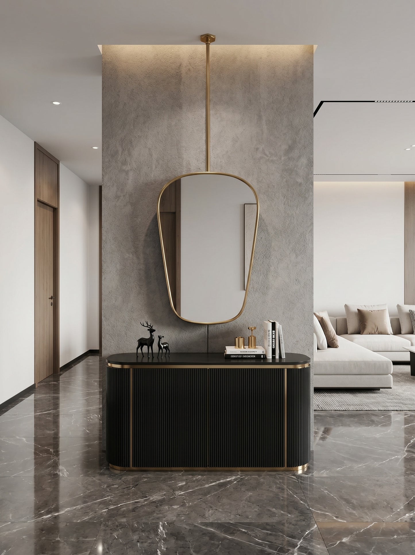 Hanging brass mirror above black console in modern hallway.