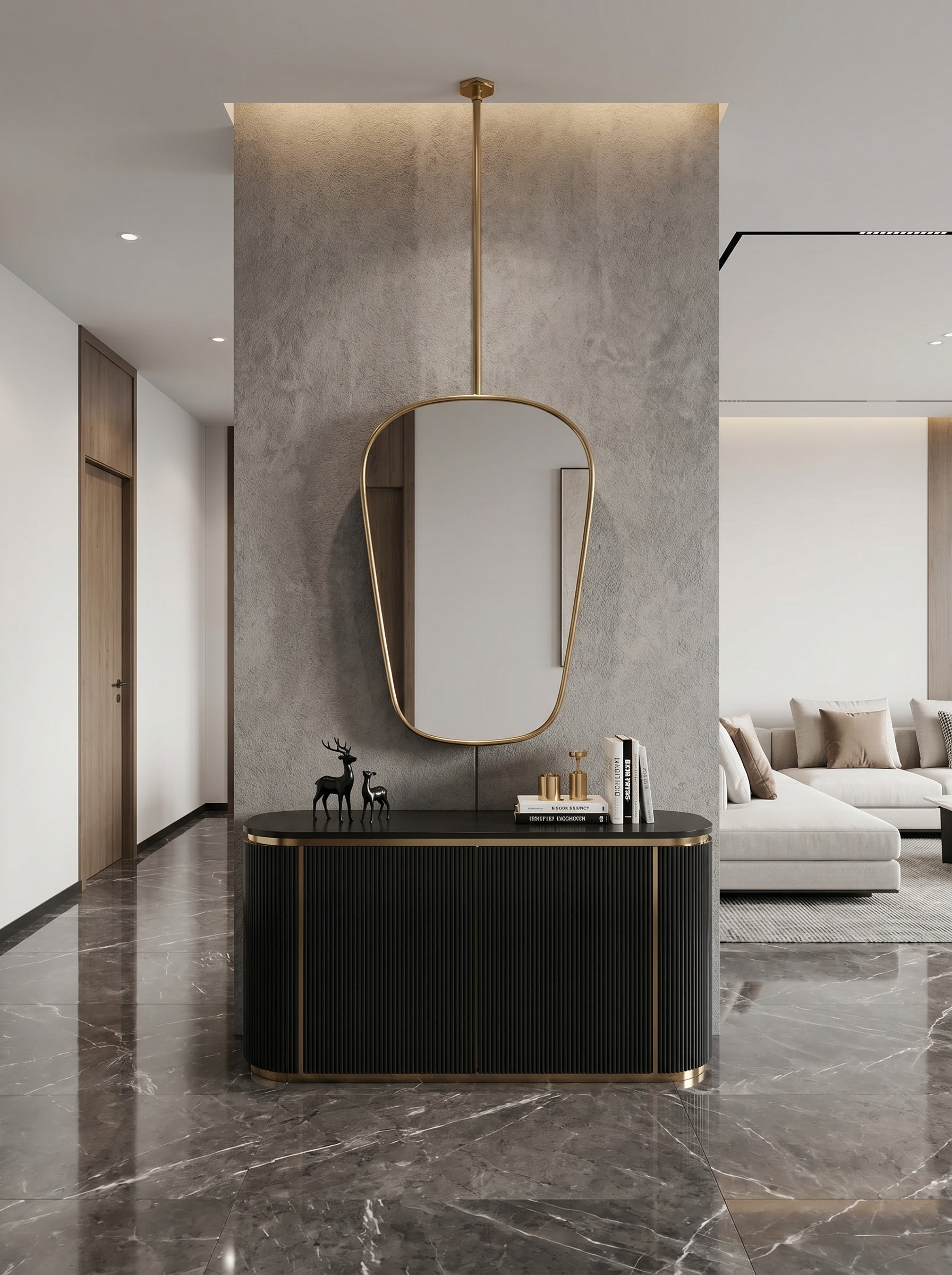 Hanging brass mirror above black console in modern hallway.